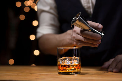 How should whisky be served?