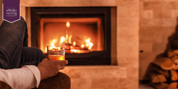 Man drinking whisky tasting set in autumn