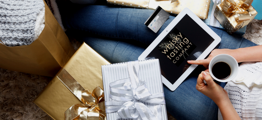 Woman Christmas shopping for whisky gifts