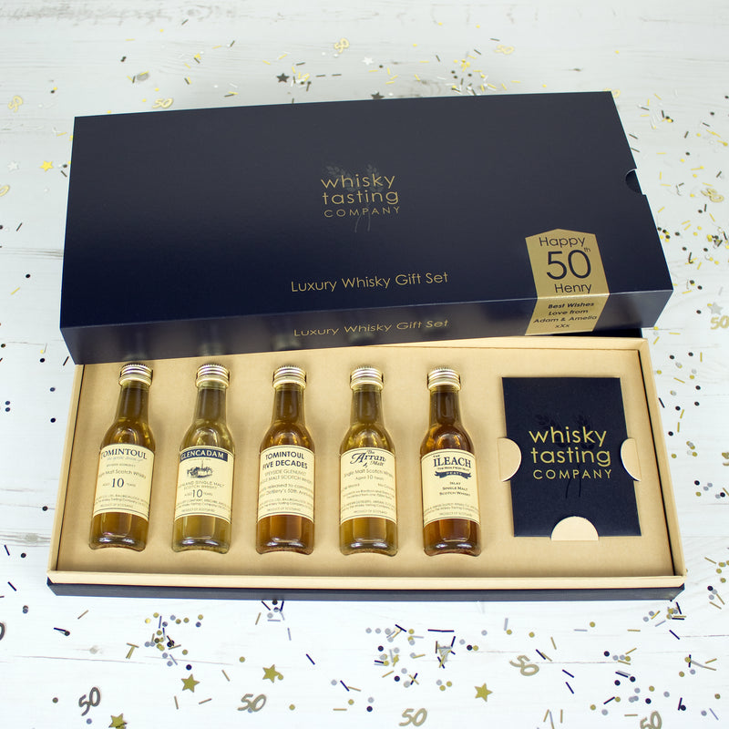 50 year old Scotch whisky and four single malt bottles whisky in personalised whisky gift set.  Personalised for 50th birthday.
