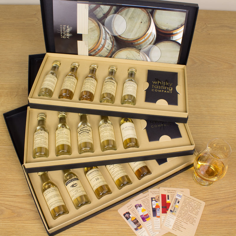 Single malt whisky gift subscription with individual tasting cards and a whisky tasting mat
